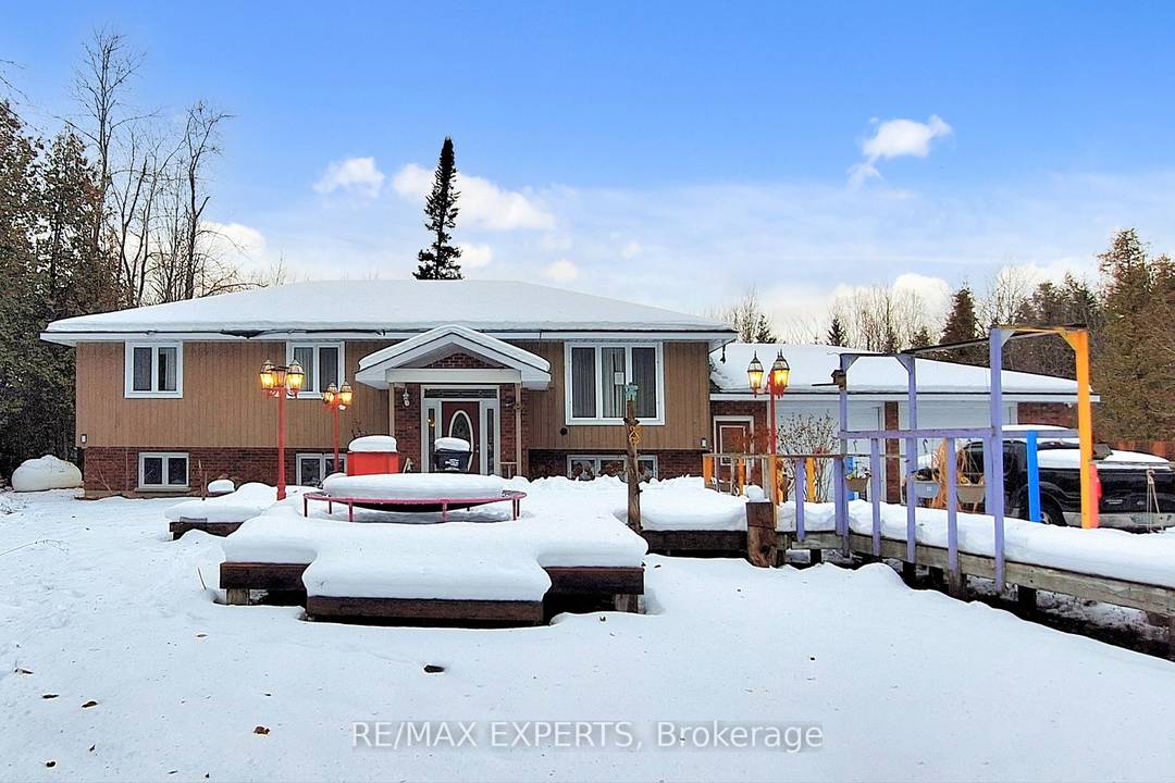 Offering space, privacy, and tranquility, this home is located on a quiet dead end road and sits on a sprawling 7 acre lot surrounded by natural scenery.