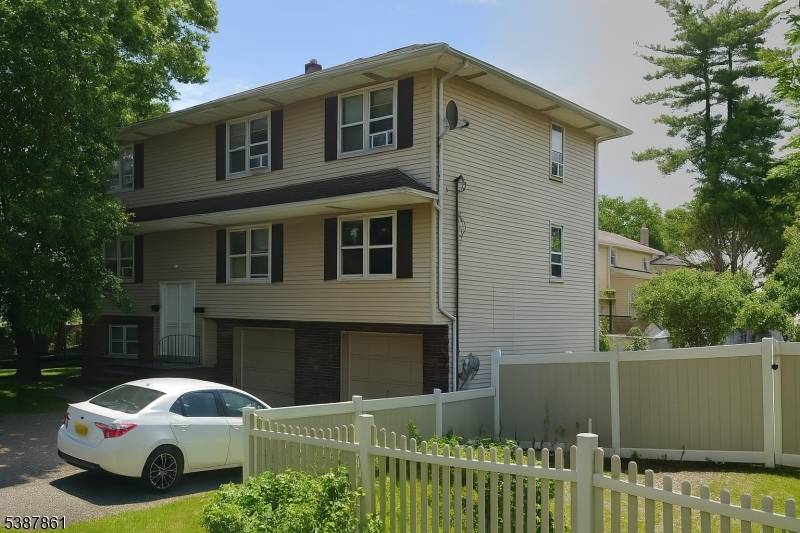 Large modern 15 room house in quiet, residential town, legal 2 family, 6 6 3 rooms apartment plus 2 car garage.