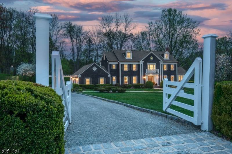Behind a gated entry on a private cul de sac, 1 White Deer Lane sits on 3.