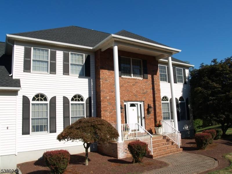Welcome home to this stunning Center Hall Colonial located in the highly desirable Branchburg Heights neighborhood of Branchburg.