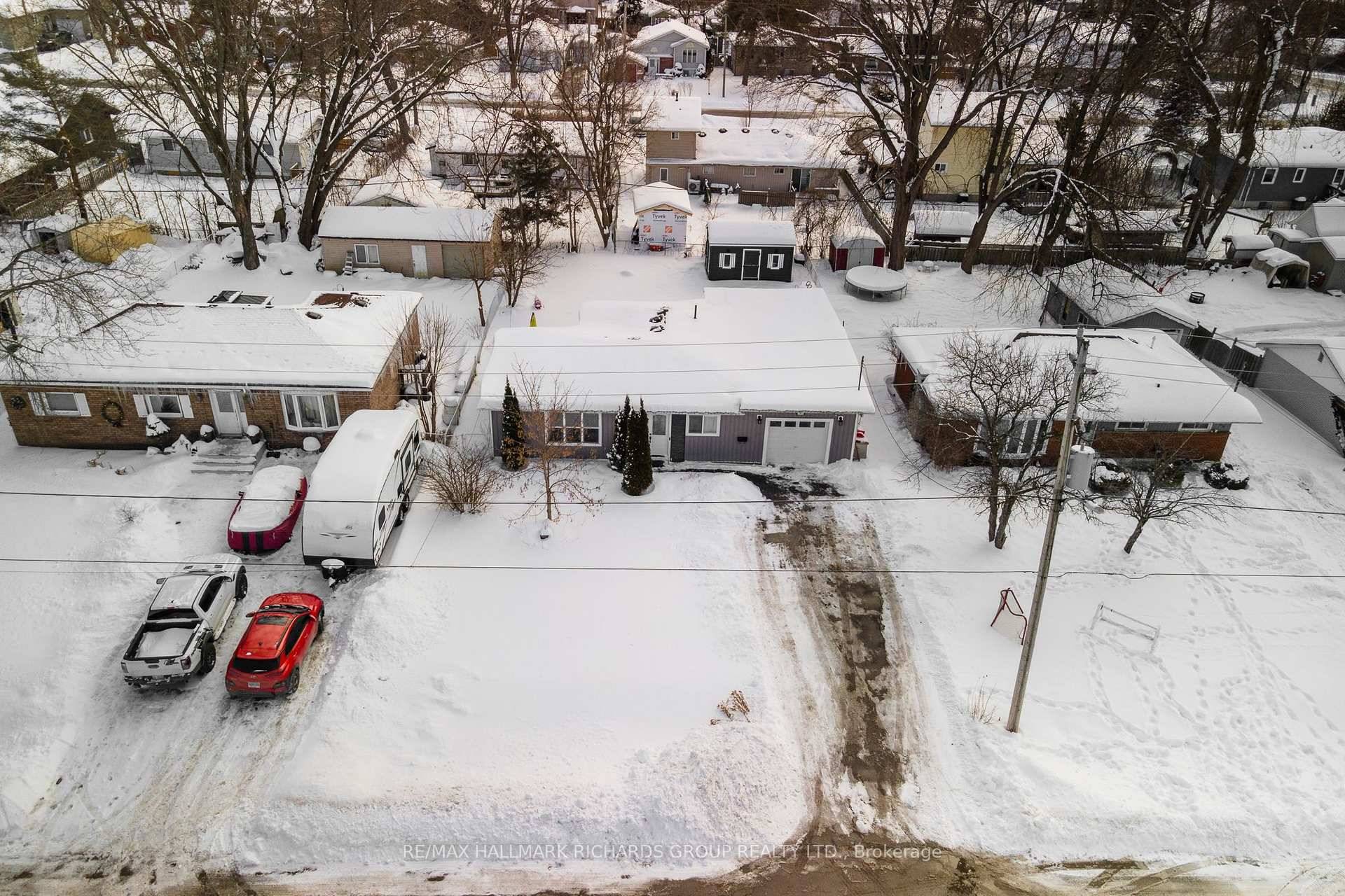 Welcome to 167 Gwendolyn Blvd, a beautifully updated 3 bedroom bungalow with a den and 2 bathrooms, sitting on a spacious 60' x 125' lot in the heart of Keswick.