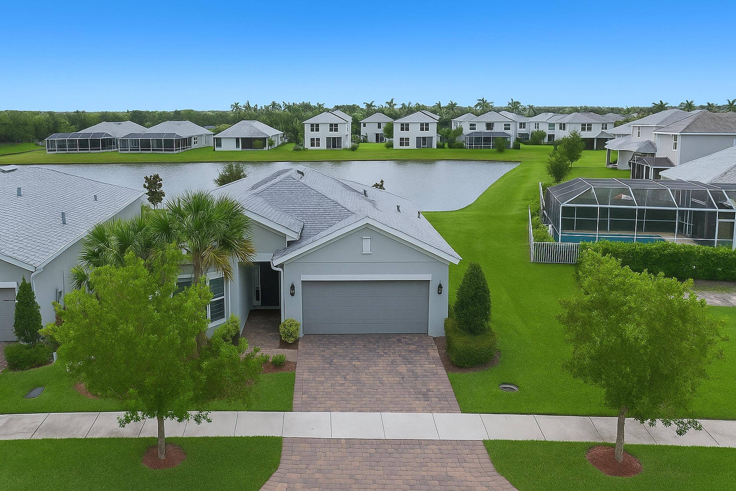 Welcome to this beautifully designed 3 bedroom, 2 bath home located in one of Tradition's most desirable neighborhoods.
