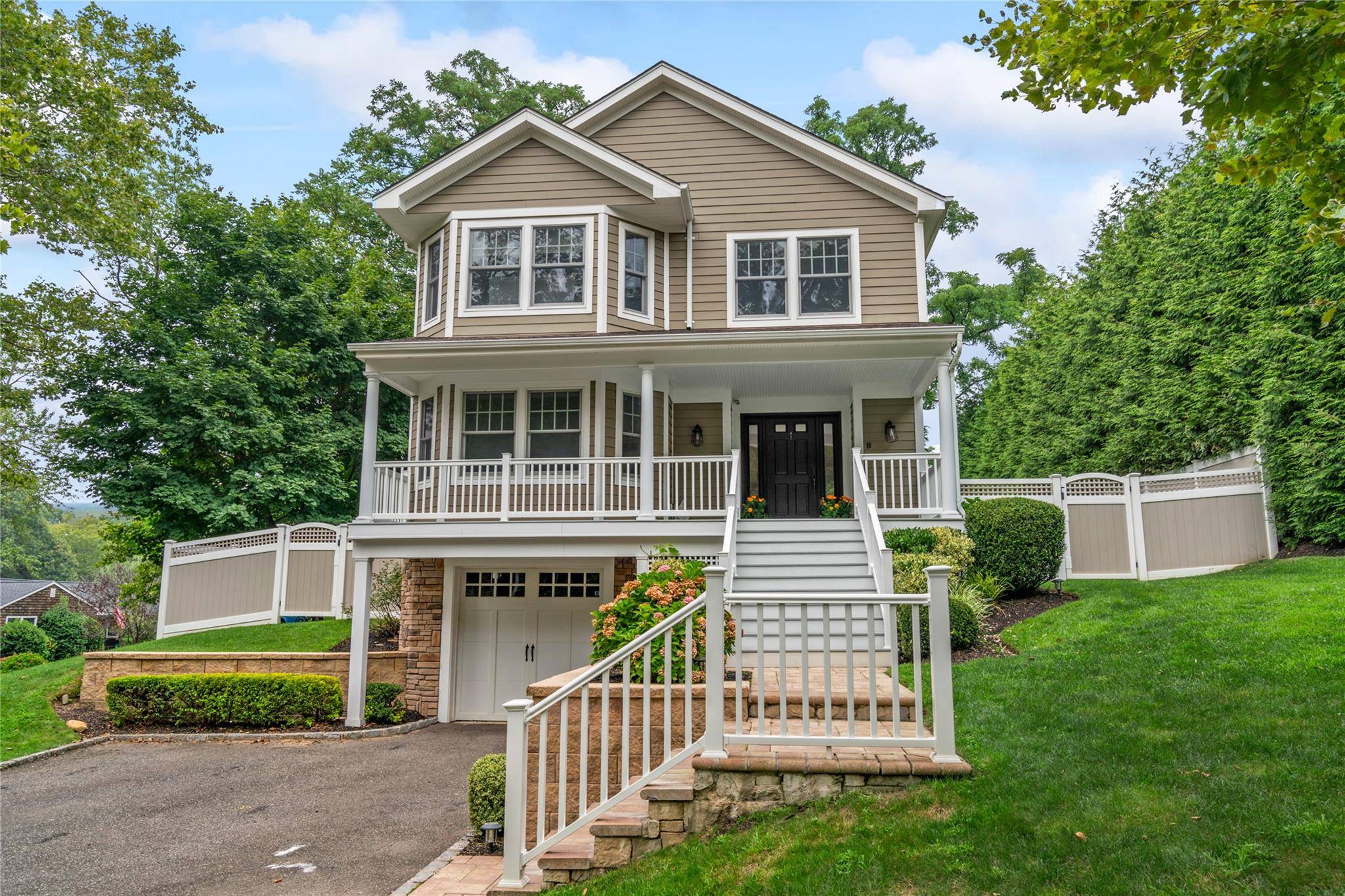This beautiful young Colonial home, built in 2014, blends timeless charm with modern comfort.