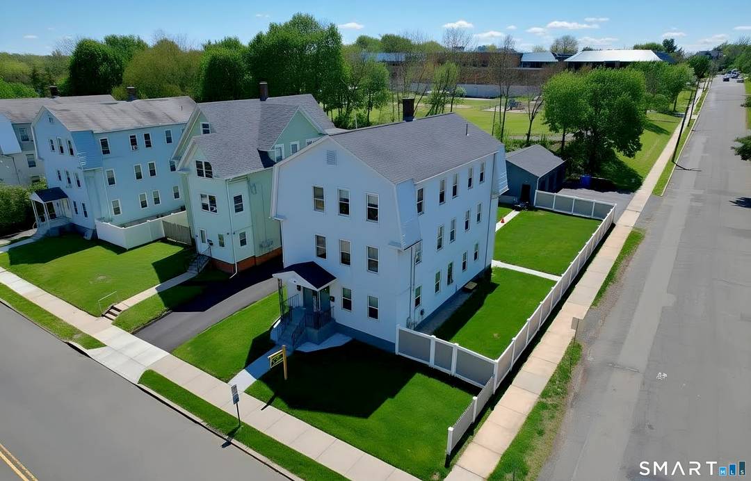 Beautifully Updated Meticulously Maintained Multifamily Home with Ample Parking and Garages.