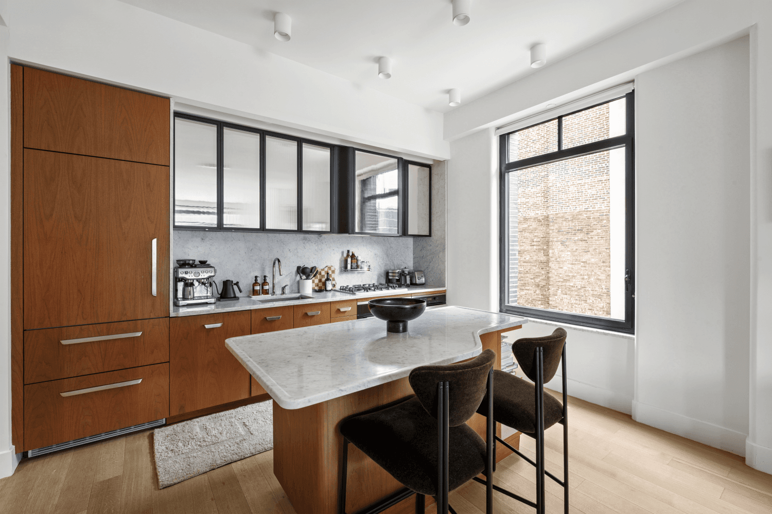 Residence 8A at Greenwich West offers a thoughtfully designed two bedroom, two bathroom condominium with both Western and Southern exposures.