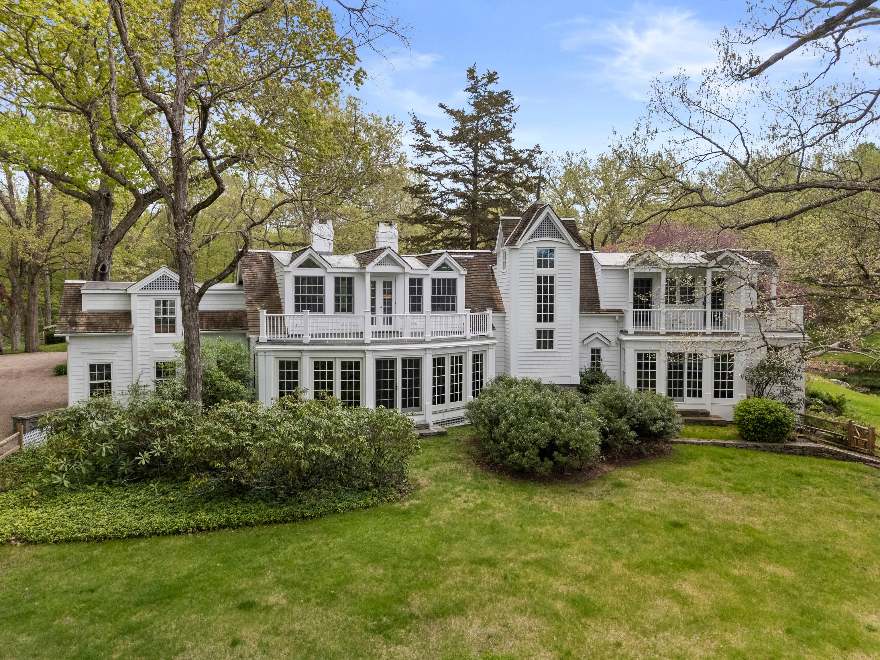 Experience the grandeur of this private estate, where the tranquil Eight Mile River flows beside a beautifully restored home.