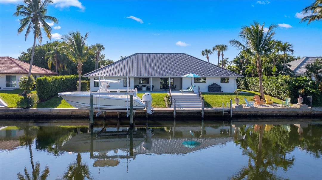Welcome to this completely reimagined waterfront residence in the highly sought after Soundings community of Hobe Sound.