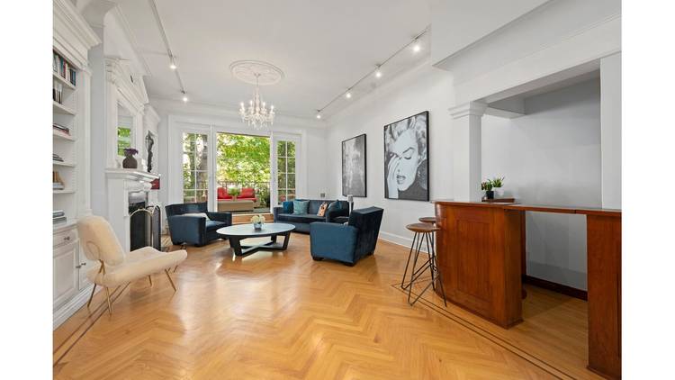 This renovated four story home on one of the most beautiful townhouse blocks in Manhattan is complete with 5 bedrooms, 4.