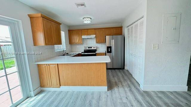 Located in the highly desired neighborhood of the Hammocks, come live in this completely renovated ample lovely corner villa.