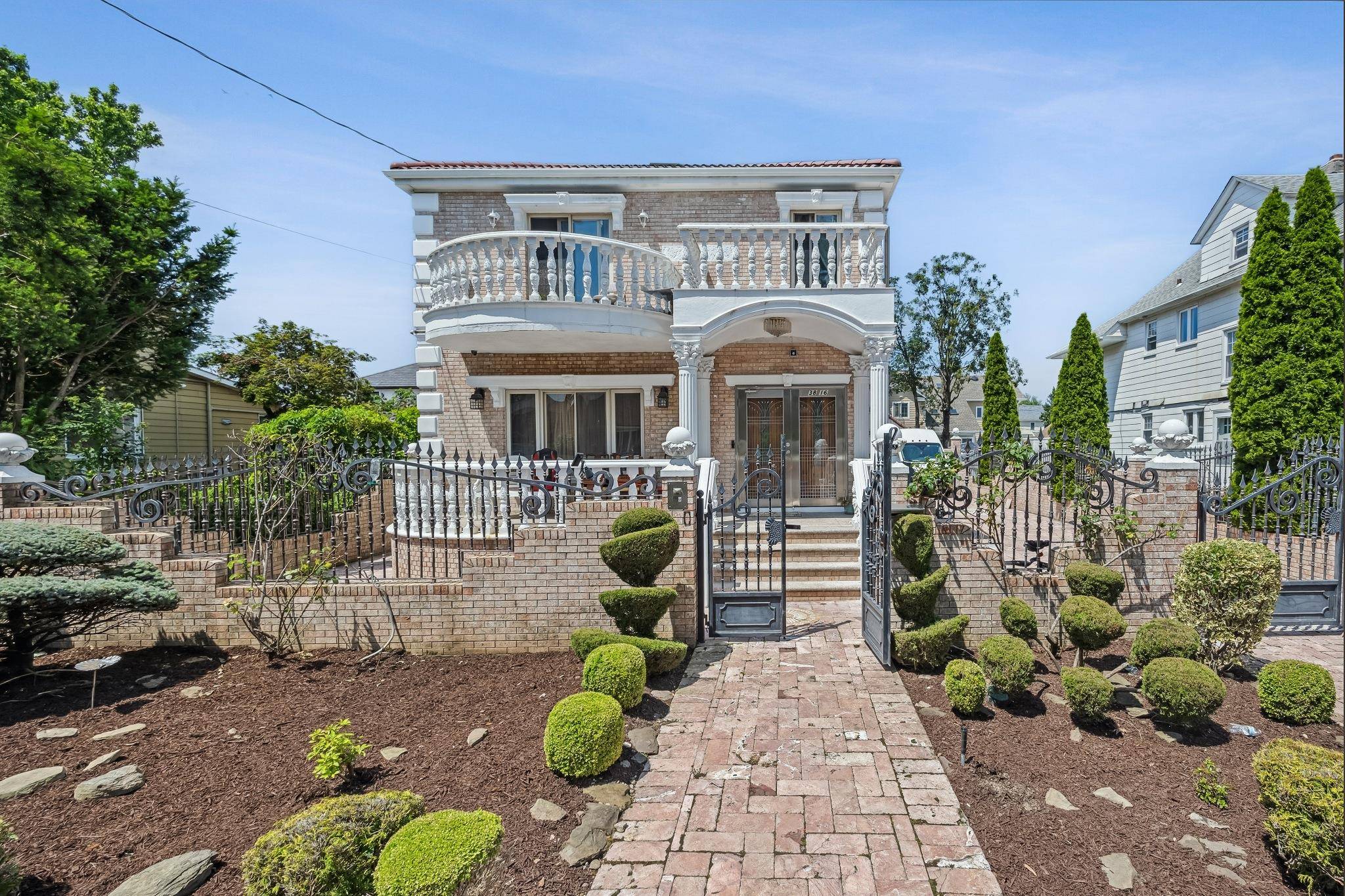 Elegant Bayside Colonial Nestled on a quiet tree lined street.