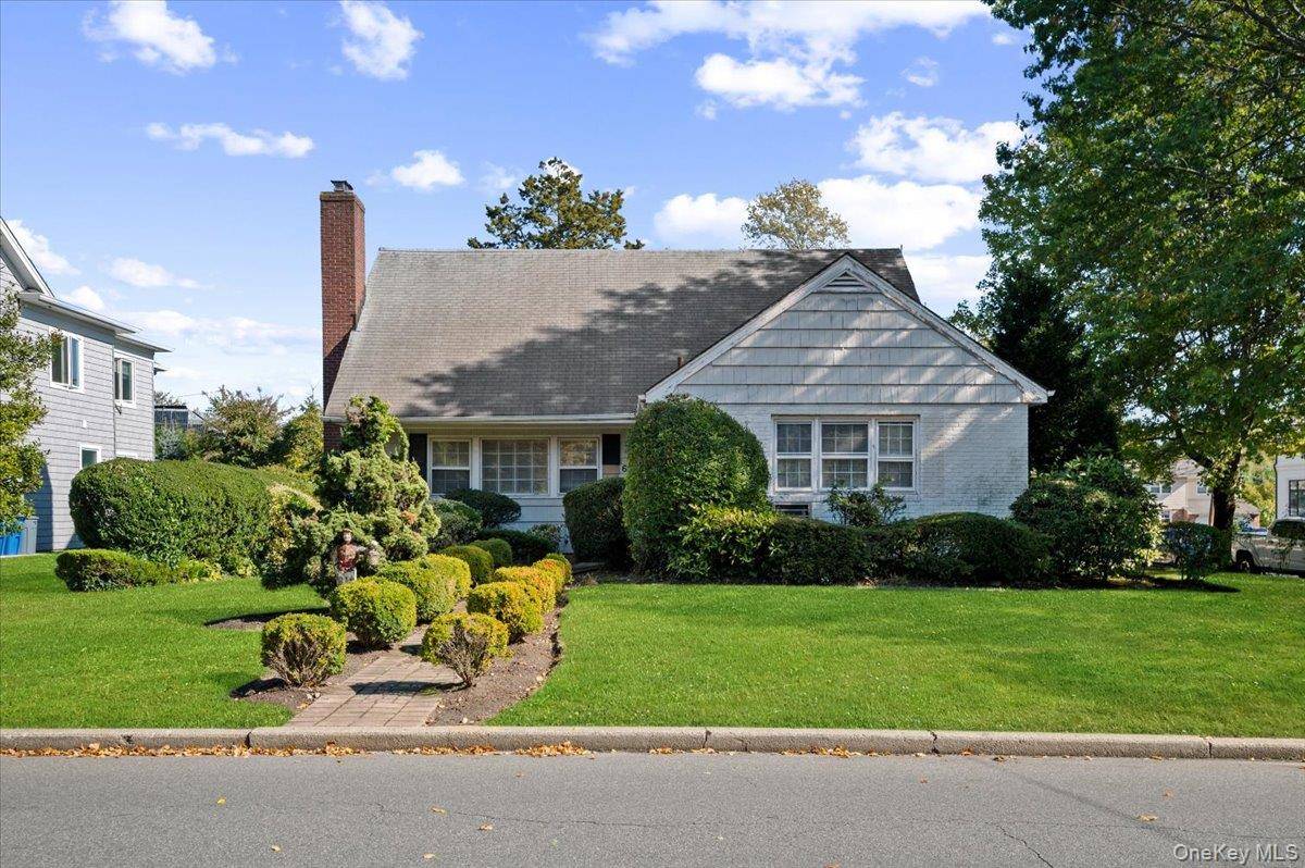 Expanded cape with bedroom on the main floor on the corner of Auerbach Ln.