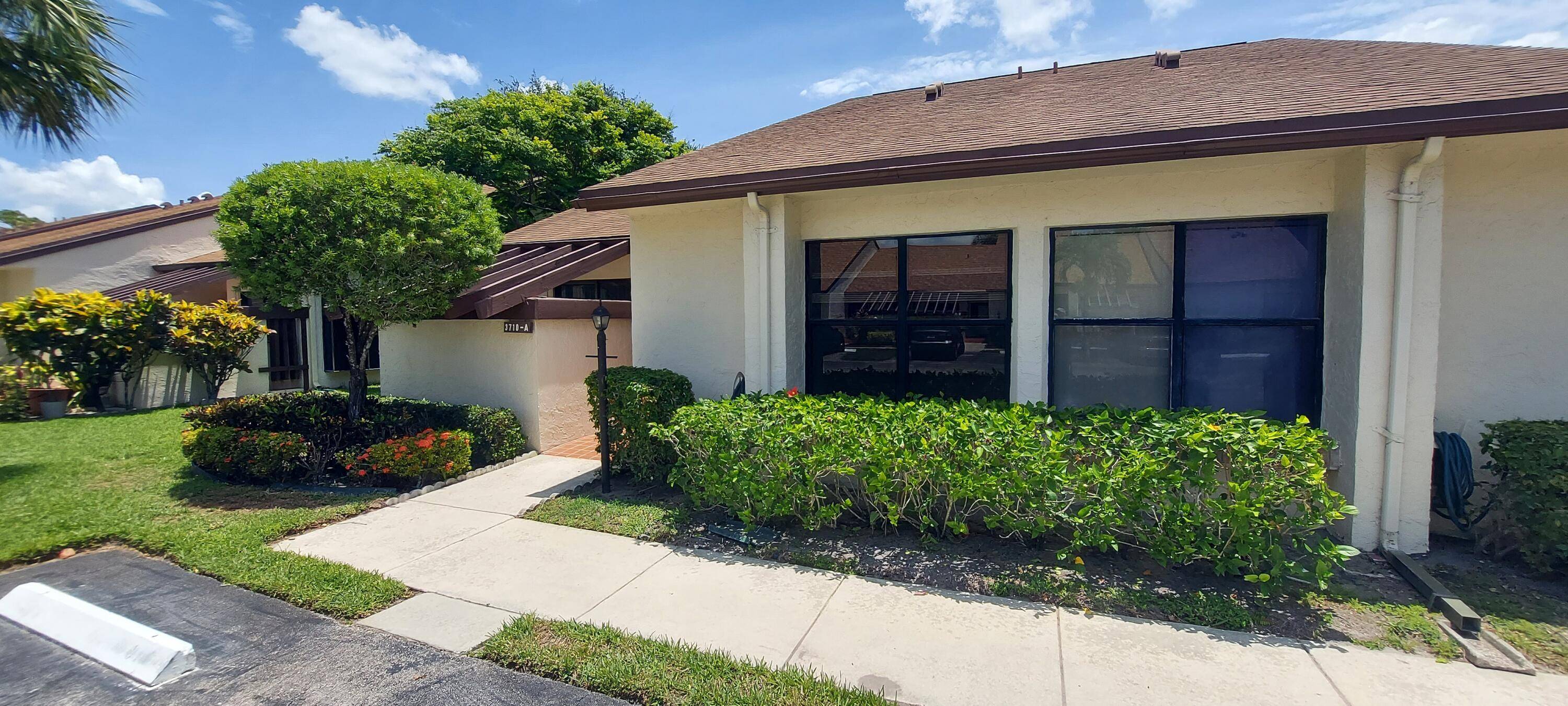 55 Immaculate, meticulously maintained end unit villa with remodeled kitchen 2012, new roof 2020, A C 2019, and water heater 2015.