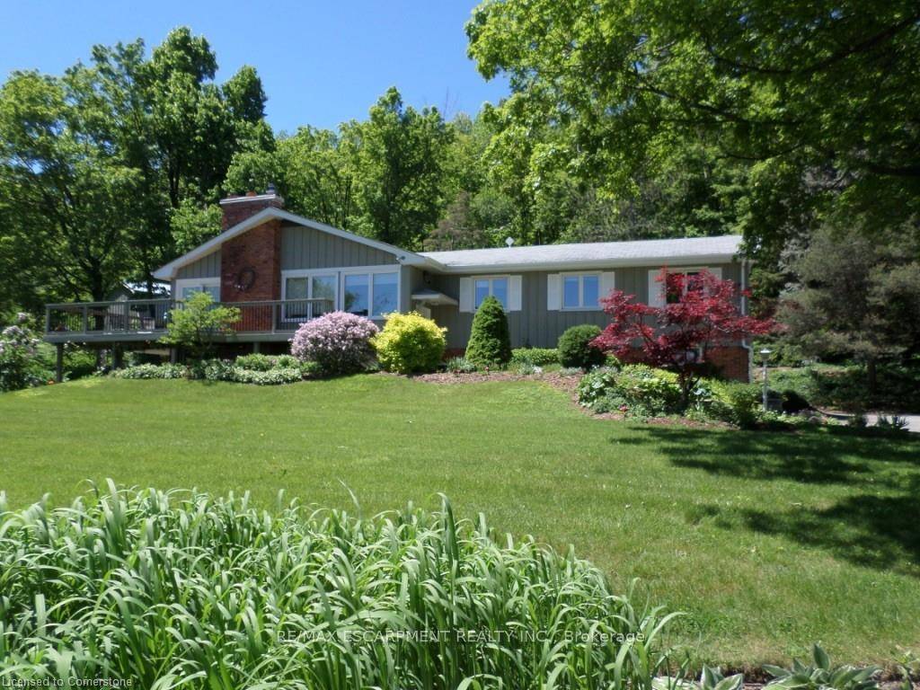 Nestled along the breathtaking Niagara Escarpment, this property offers over six acres of natural beauty and endless potential, just minutes from city conveniences.