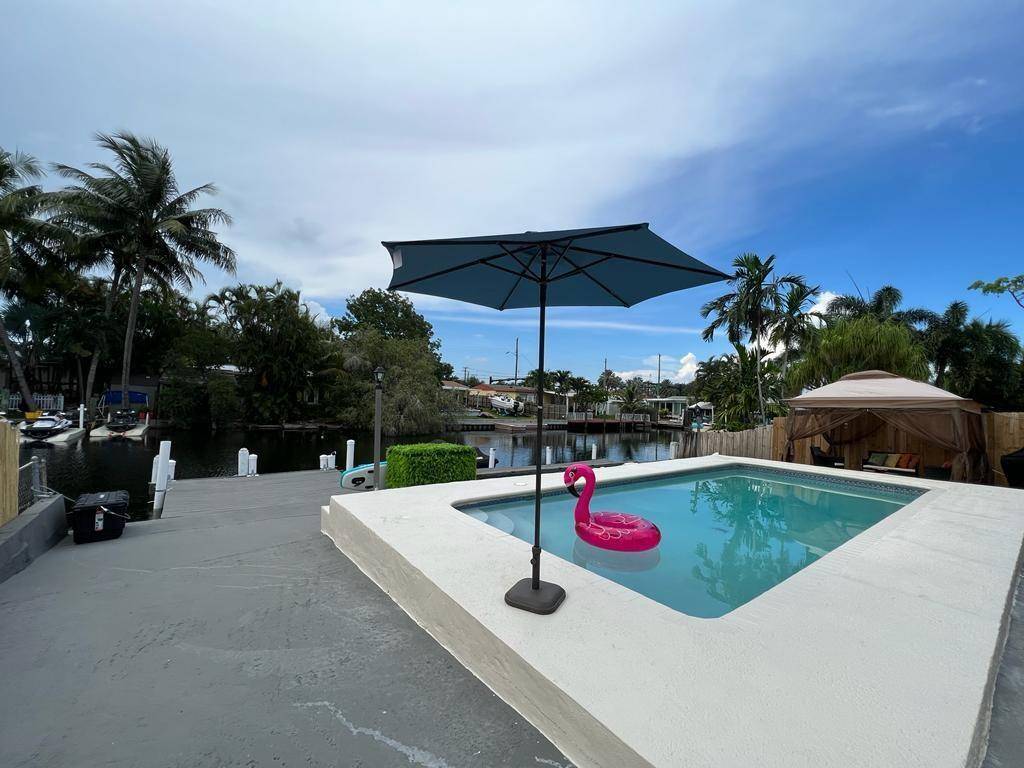 Stunning fully furnished waterfront pool home in the heart of Hollywood available May 1, 2026 for seasonal or annual rental.