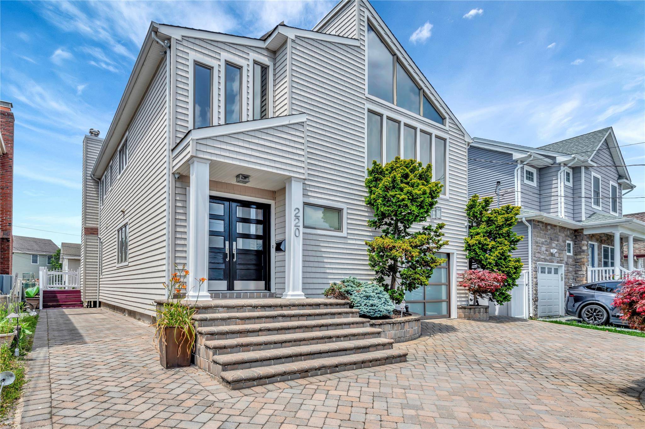 Exclusive modern elevated waterfront property in South Bellmore with elevation certificate.