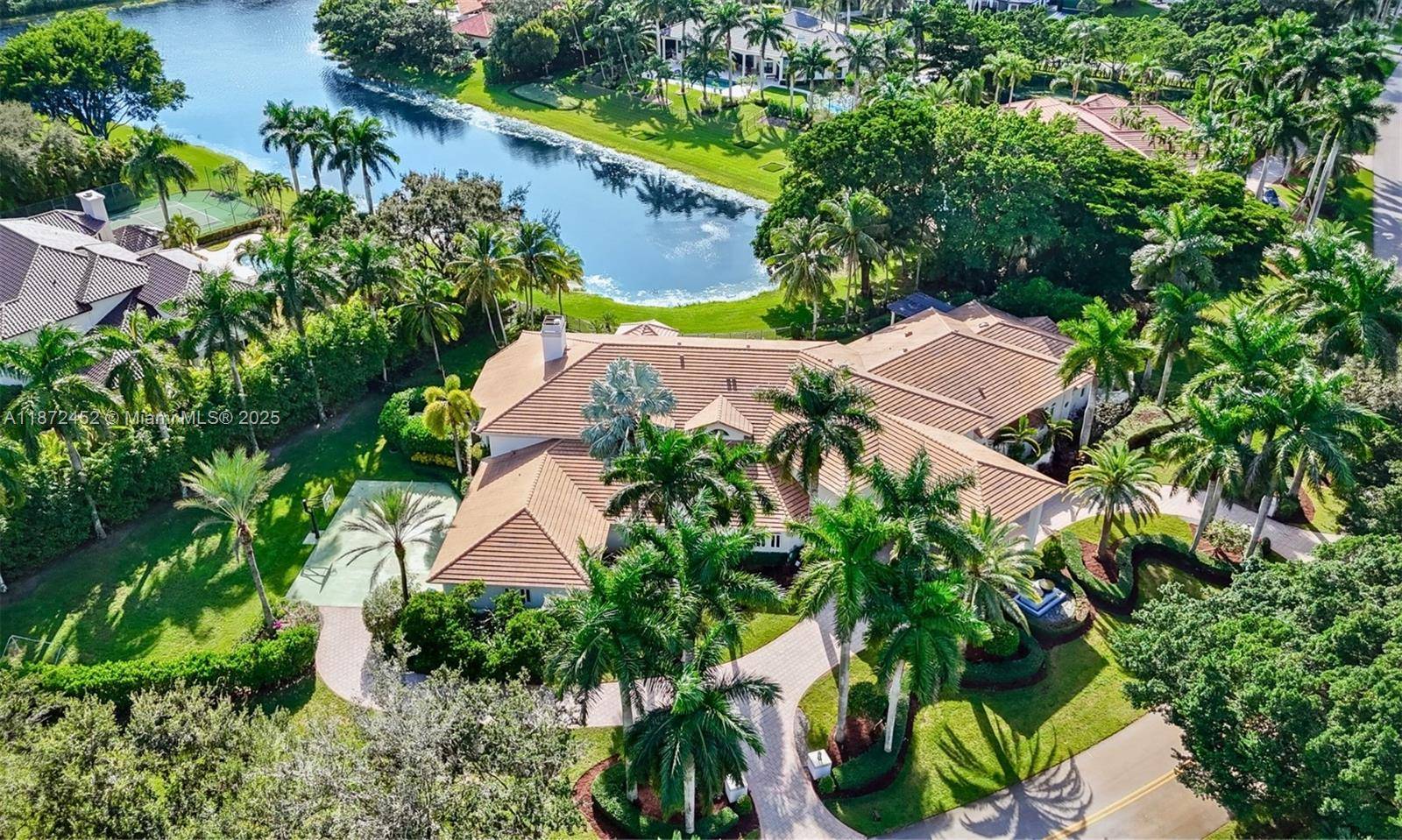 Experience refined lakefront luxury in the prestigious gated community of Windmill Ranch Estates.