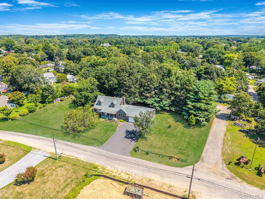 Wake up to the sound of gentle waves and breathtaking sunrises over Gardiner Bay in this charming four bedroom, two bath coastal retreat.