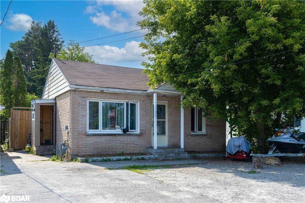 This charming bungalow, zoned C2 Core Commercial, is brimming with potential.