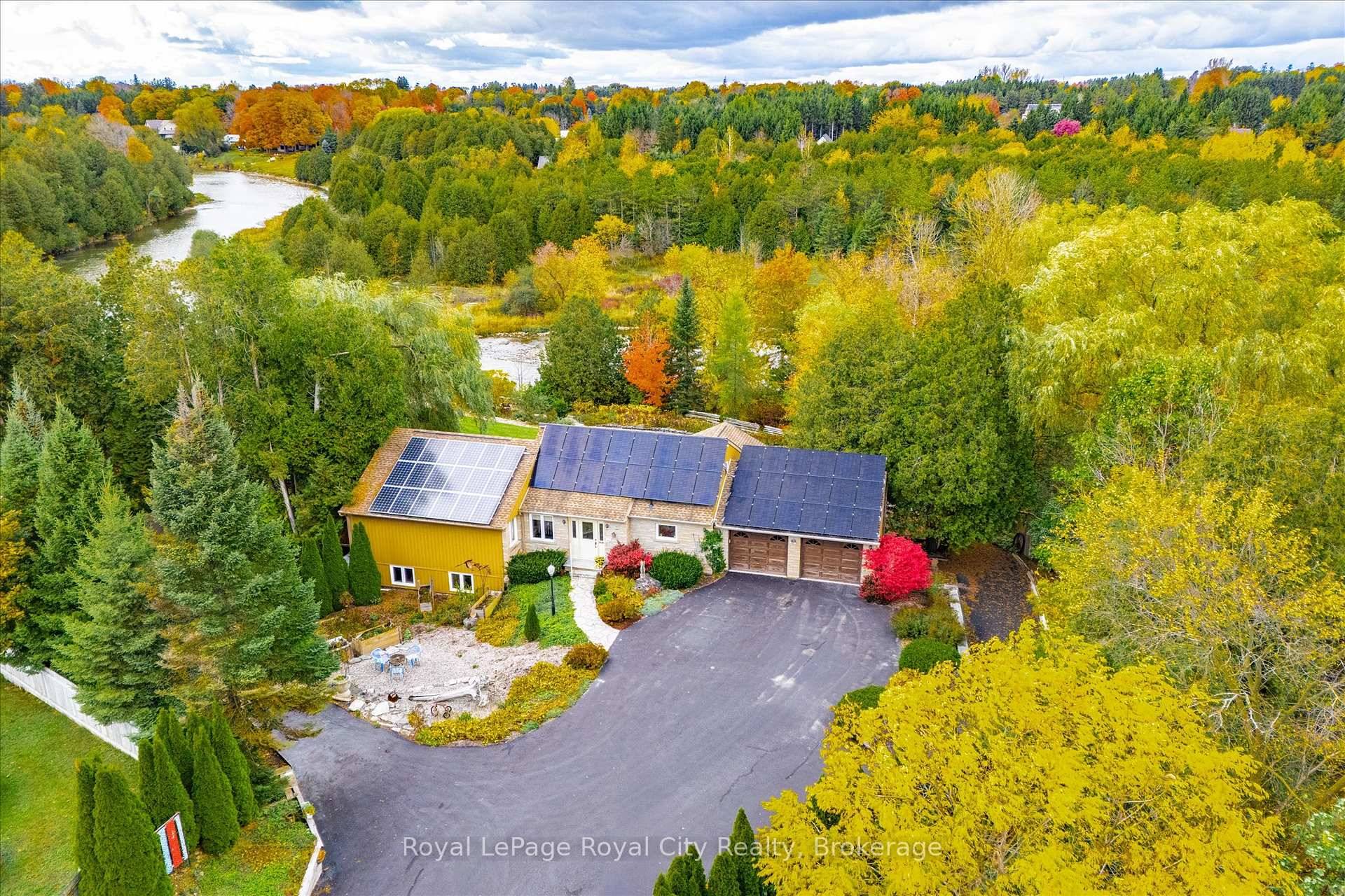 Grand River Paradise ! Over 400 feet of arguably the nicest river frontage on the Grand.