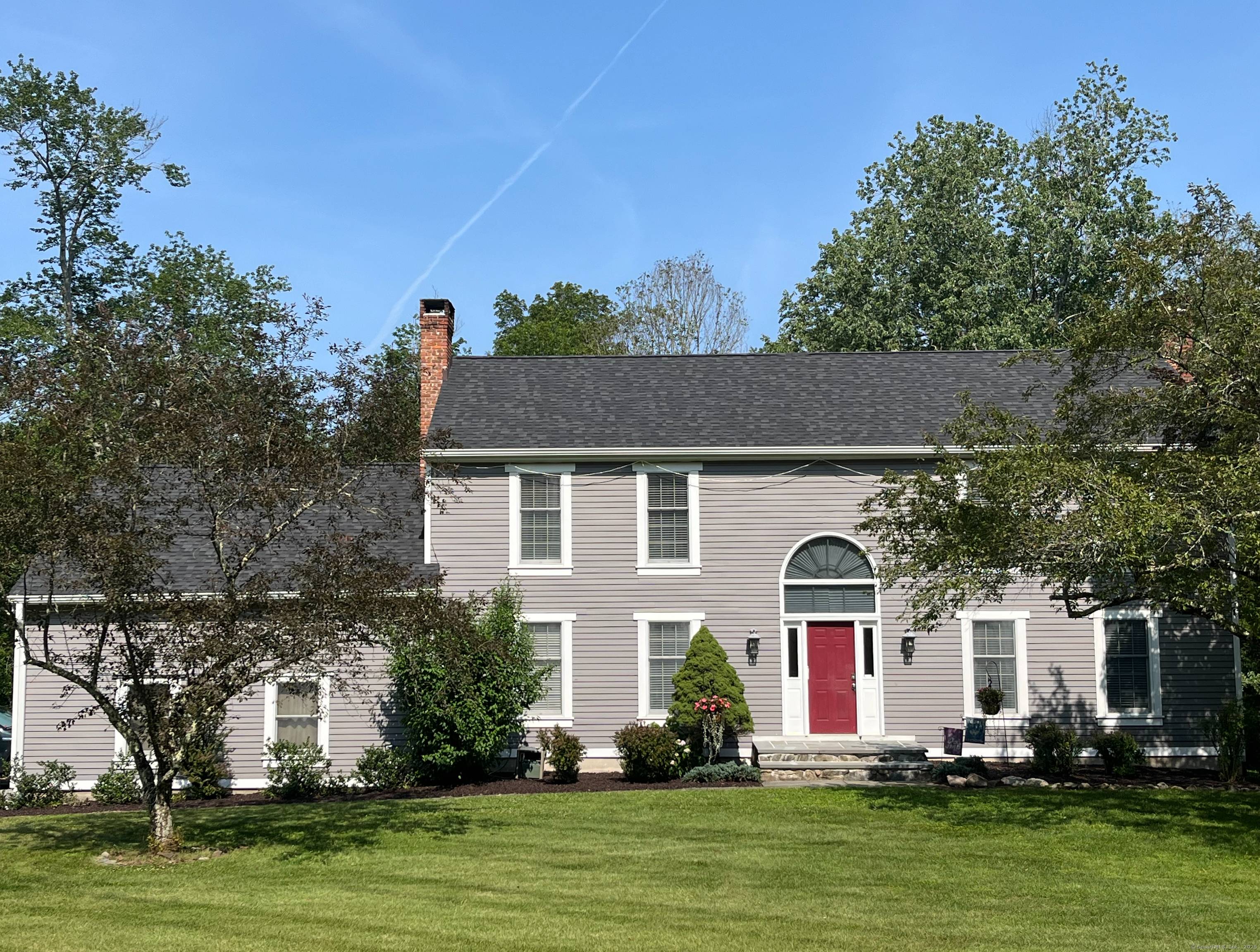 Exceptional center hall colonial offers the perfect blend of privacy and convenience, nestled on a generous 1.