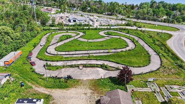 Offering over 8 Acres of Land, this high profile corner property at 10 Toner Street provides outstanding visibility along a major route between Collingwood and Wasaga Beach.
