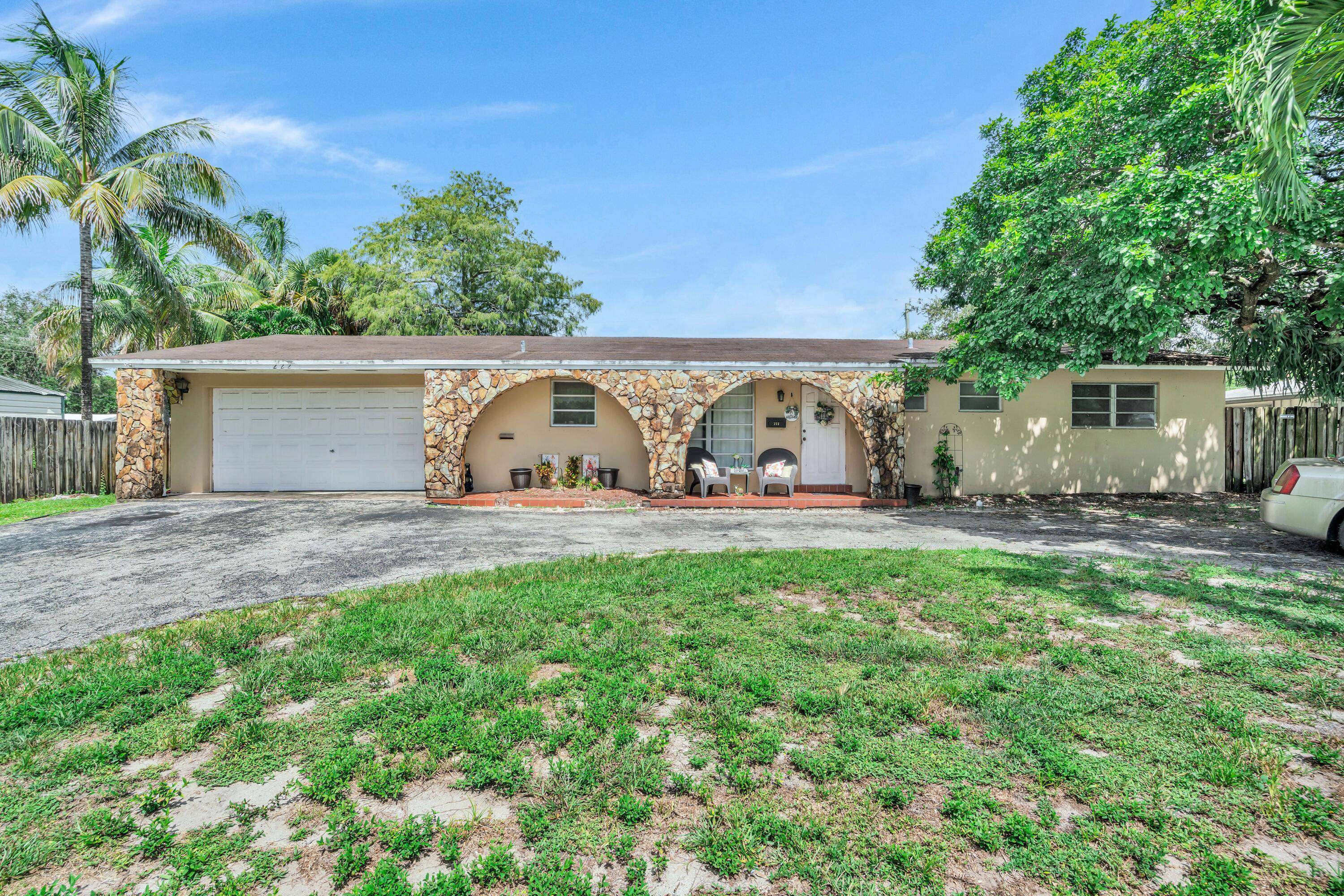 4 bedroom, 2 bathroom single family home sits on a large lot with a circular driveway and tons of curb appeal !