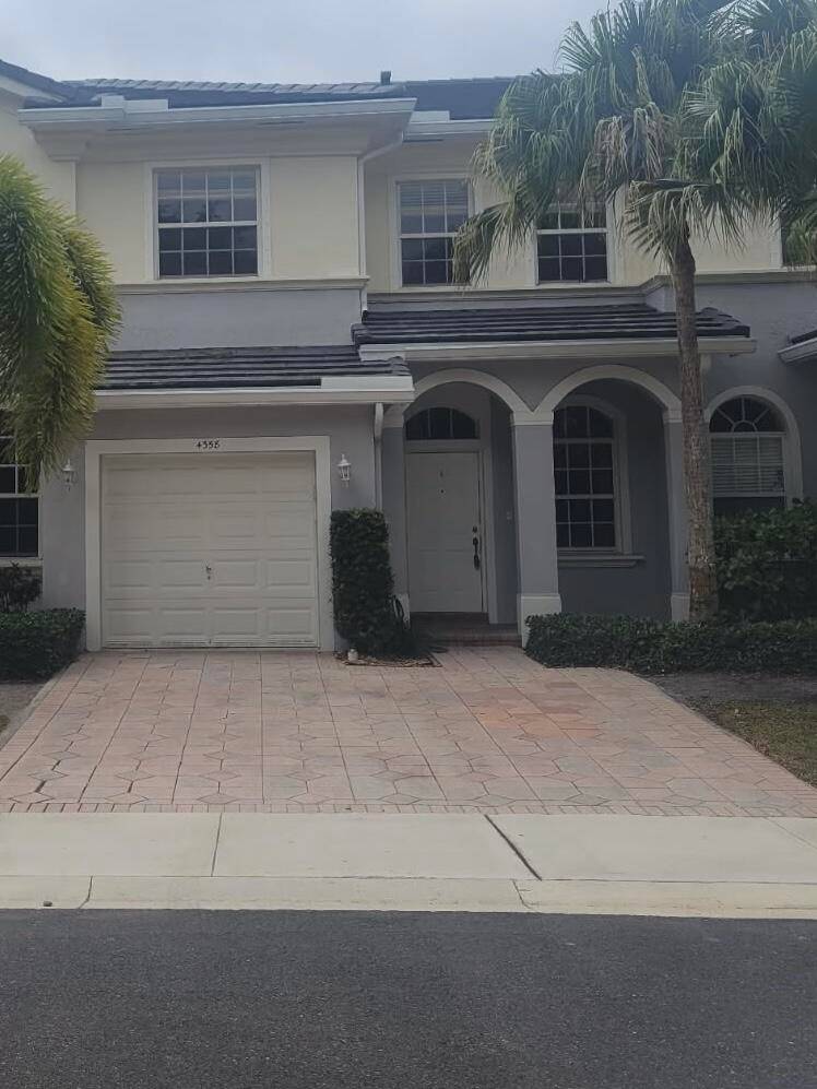 Stylish, Move in ready, Low HOA, 3 bedroom, 2 1 2 bath, garage townhome in vibrate Delray Beach.