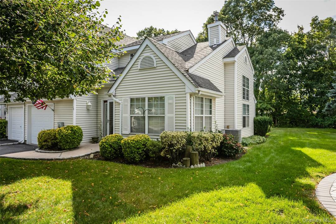 Lovely End unit located across from pond with pretty pond views.