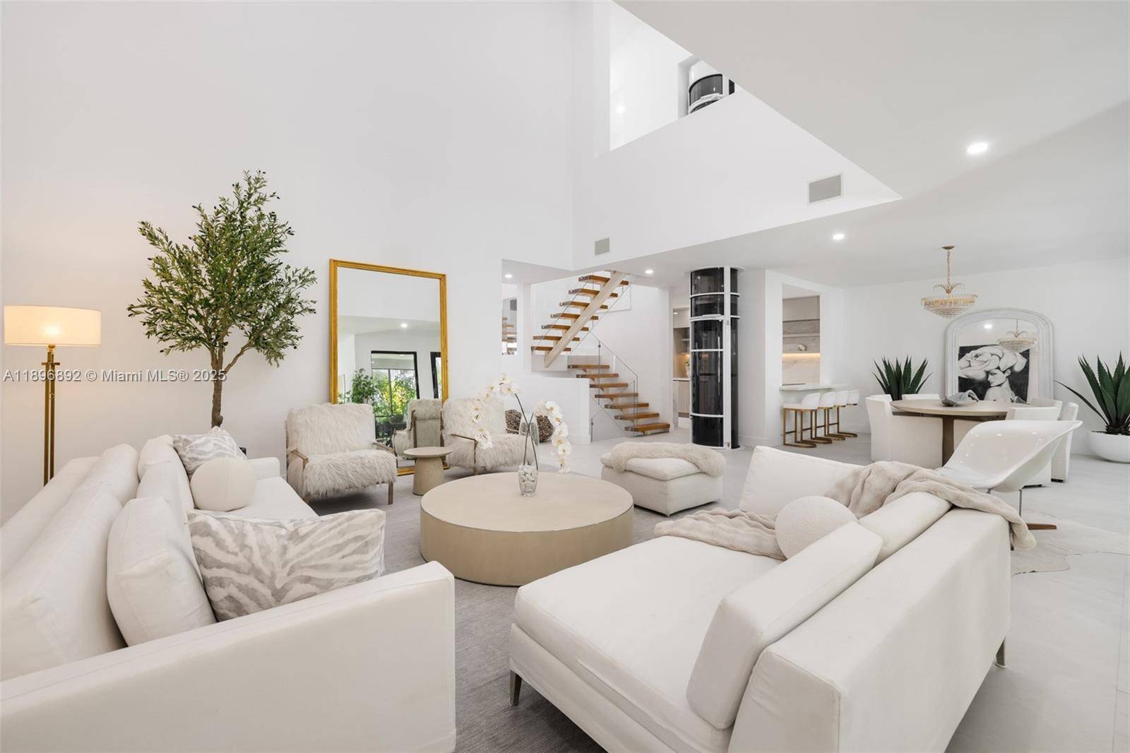 Stunning tri level villa in L Hermitage, a 24 7 guard gated community on Biscayne Bay.