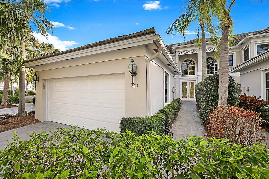 Open floor plan with high ceilings and water view.
