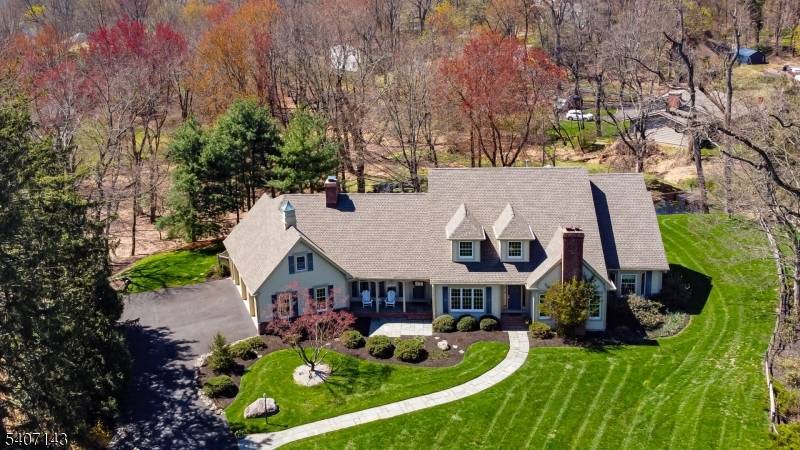 LOCATION LOCATION ! Nestled on a coveted private lane, this exceptional and stunning custom designed Colonial blends privacy, craftsmanship, and timeless elegance.