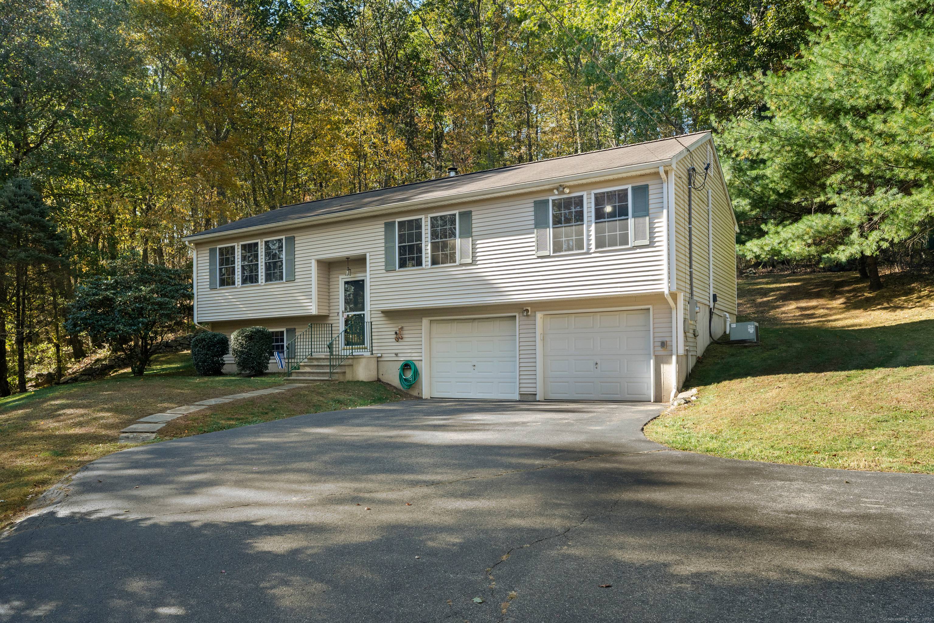 Welcome to this well maintained 3 bedroom, 2 bath raised ranch set on a picturesque 2.
