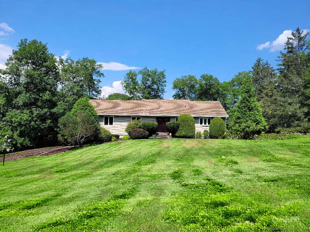 Welcome to 7 Carriage Lane, New Fairfield, Connecticut tucked away on a quiet, picture perfect cul de sac, this charming home is set back from the road surrounded by other ...