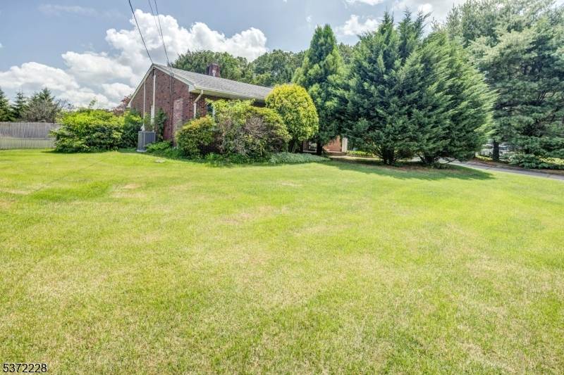 This charming ranch style home features a spacious and modern kitchen, three cozy bedrooms, and two full bathrooms.