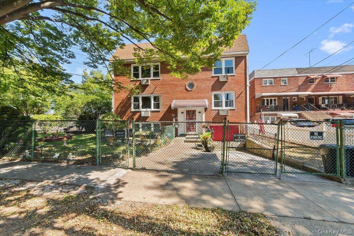 Welcome to this stately two story brick multi family home that sits prominently on a sprawling corner grassy lot, providing multiple exposures for light amp ; fresh air.