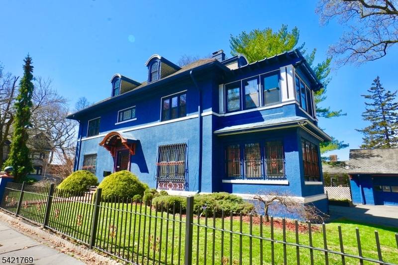 This exquisite Colonial, nestled in the heart of historic Forest Hills, captures timeless elegance with refined architectural details and abundant old world charm.