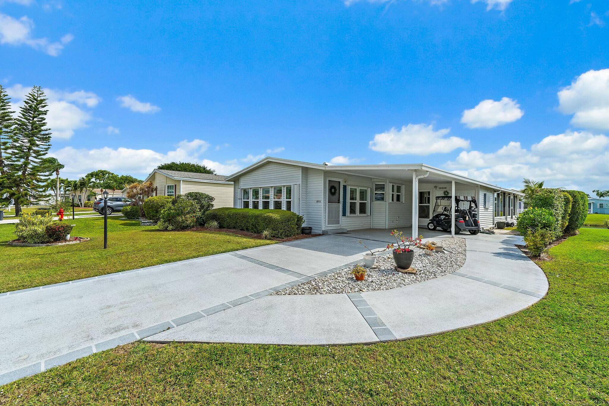 Land Owned Lakefront Beauty in Savanna Club 55 Community Don't miss this gem featuring 2 spacious bedrooms, 2 baths, a living room, and a family room, plus a glass enclosed ...