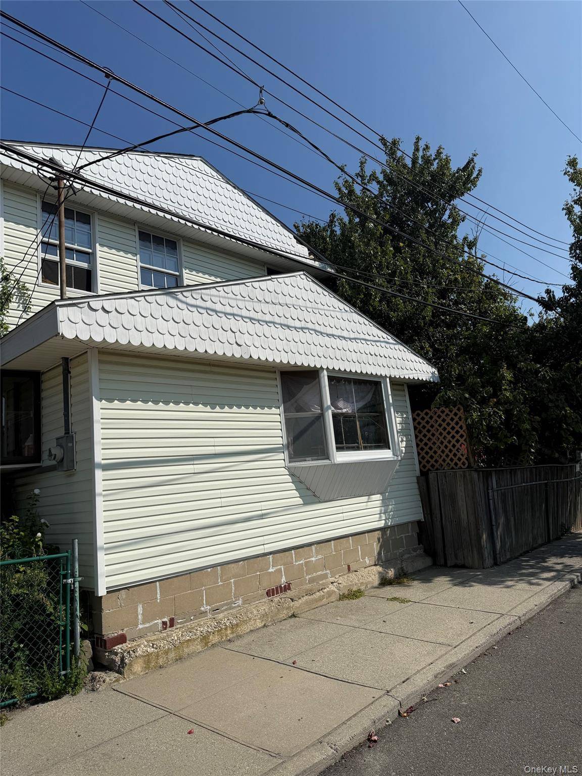 Exceptional value and tremendous upside on this corner, large, versatile property featuring two separate homes.