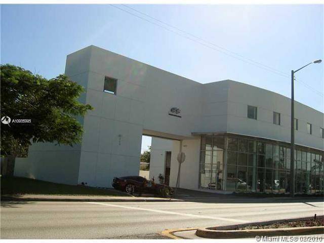 State of the art showroom in Coral Gables less than ten years old, impact floor to ceiling glass in showroom, located right on Dixie Hwy.