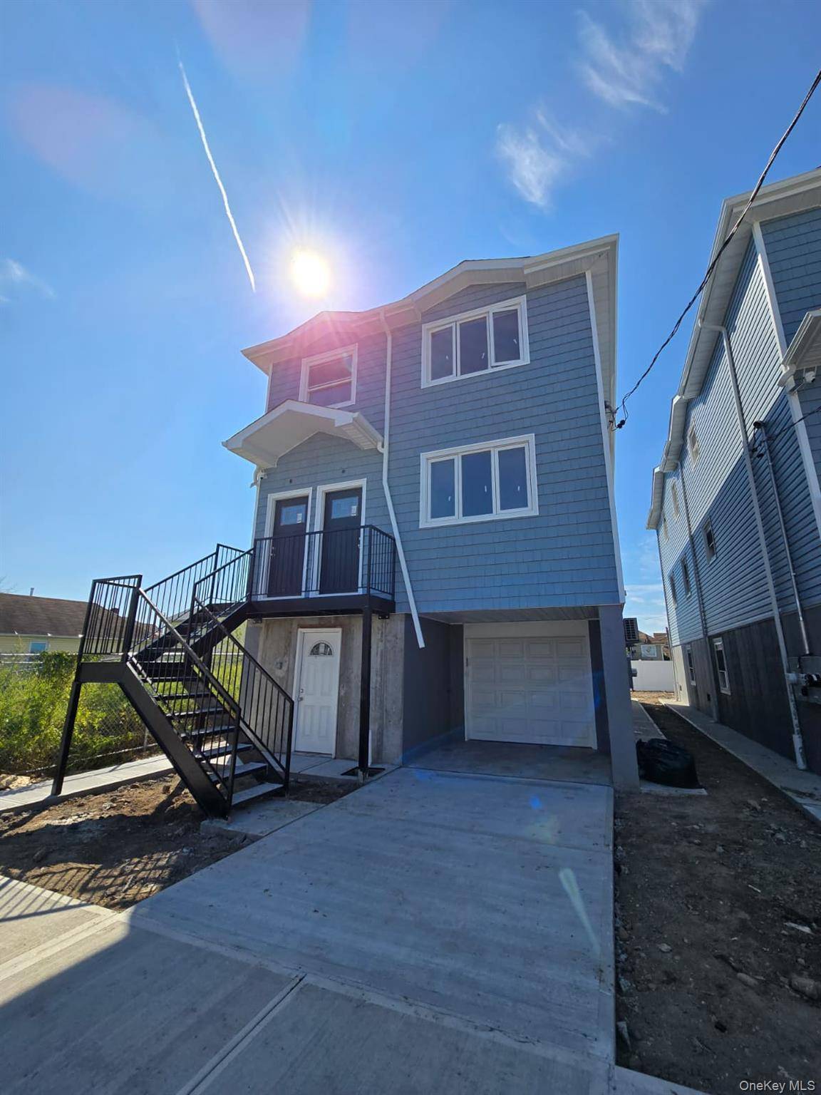 Welcome to 449 Beach 45th Street, a brand new two family home in the heart of Far Rockaway, Queens.