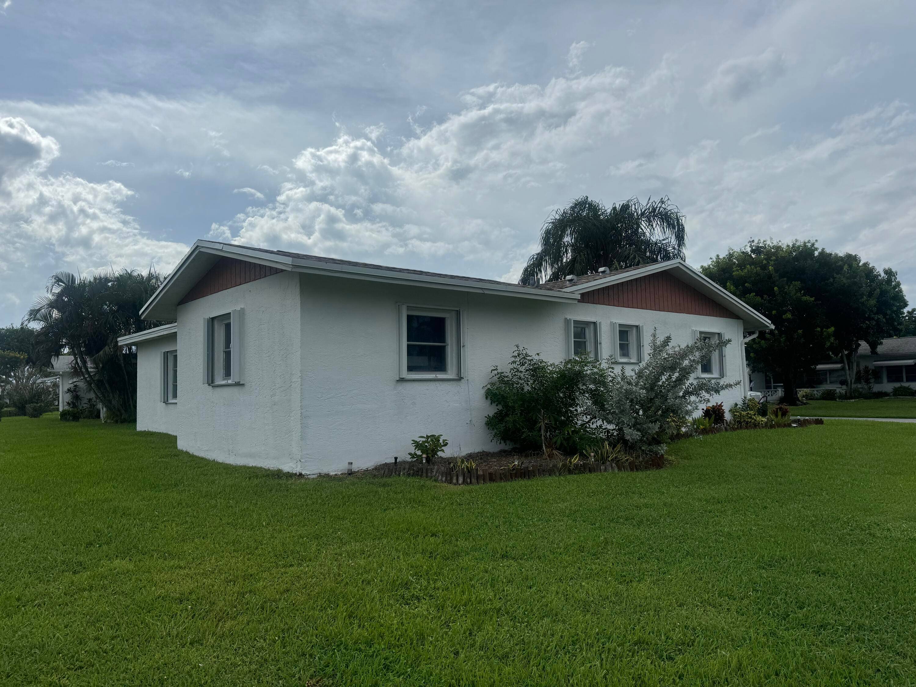 Charming 2 BR, 2 BA home with 1 car garage on a corner lot.