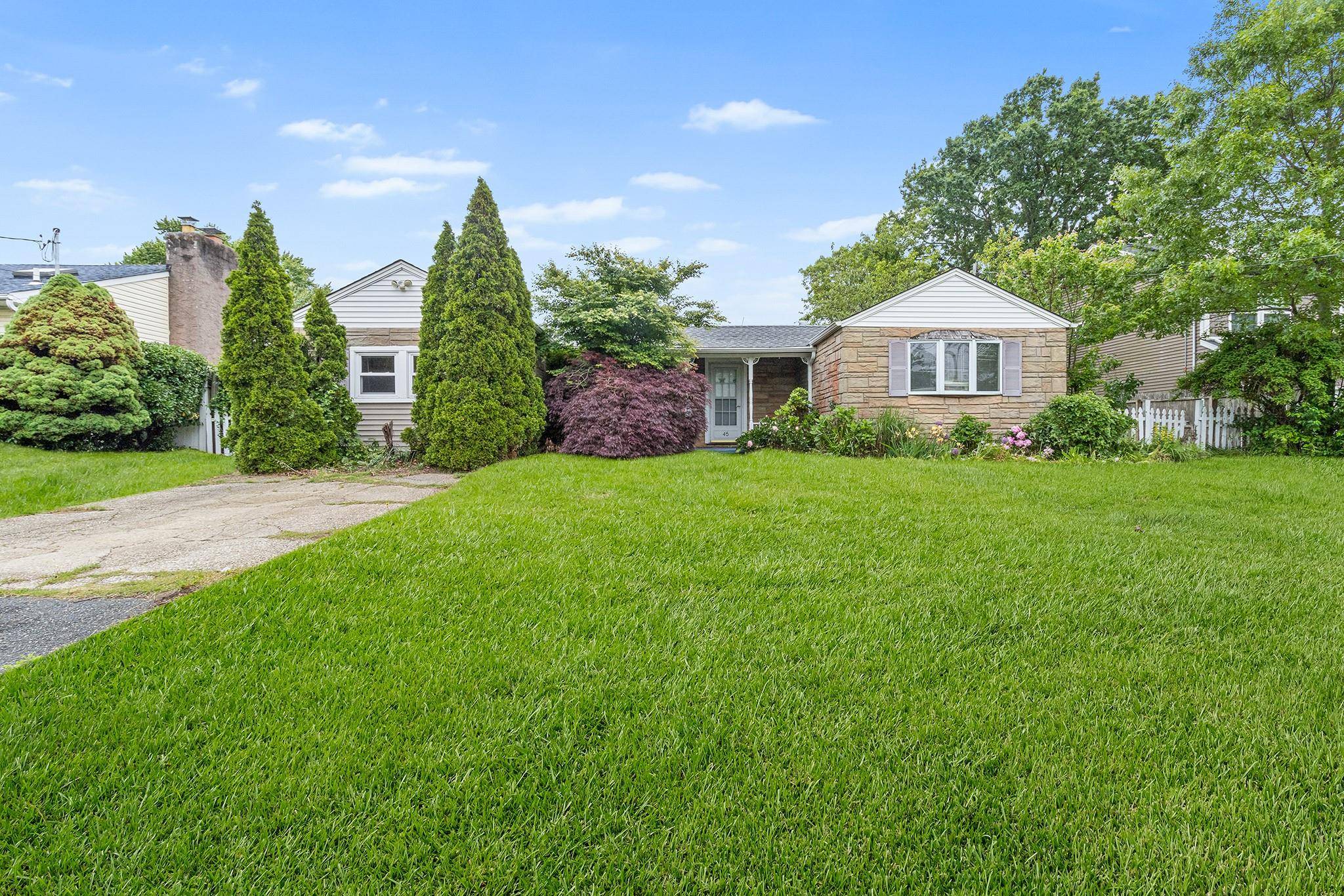 Charming ranch style home with great curb appeal, a freshly installed roof, and a welcoming front entry !