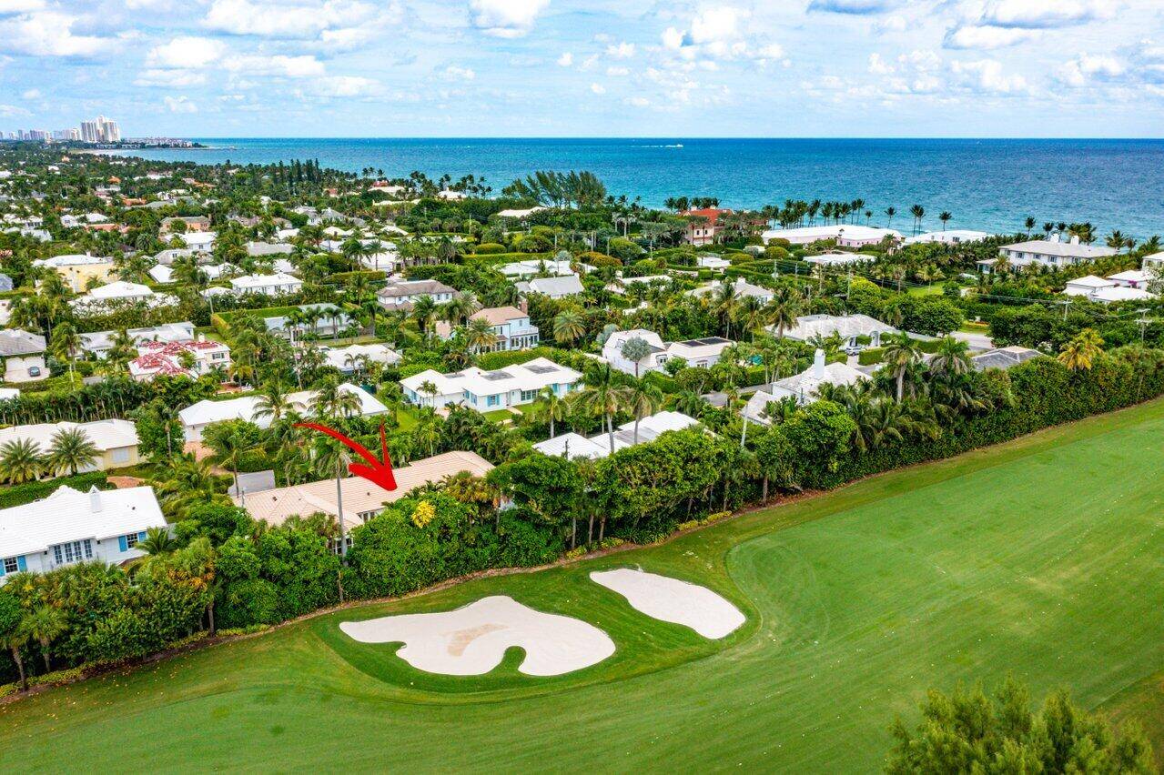 This bright, updated Bermuda style 4 bed and 4 bath home captures the charm of Palm Beach with the coveted privacy of being on the golf course.
