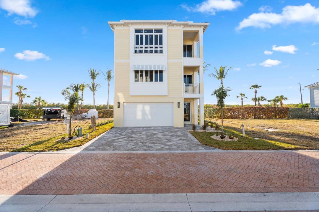 Set just steps from the sand, this newly built 2025 coastal home offers direct views of both the Atlantic Ocean and the Intracoastal Waterway.