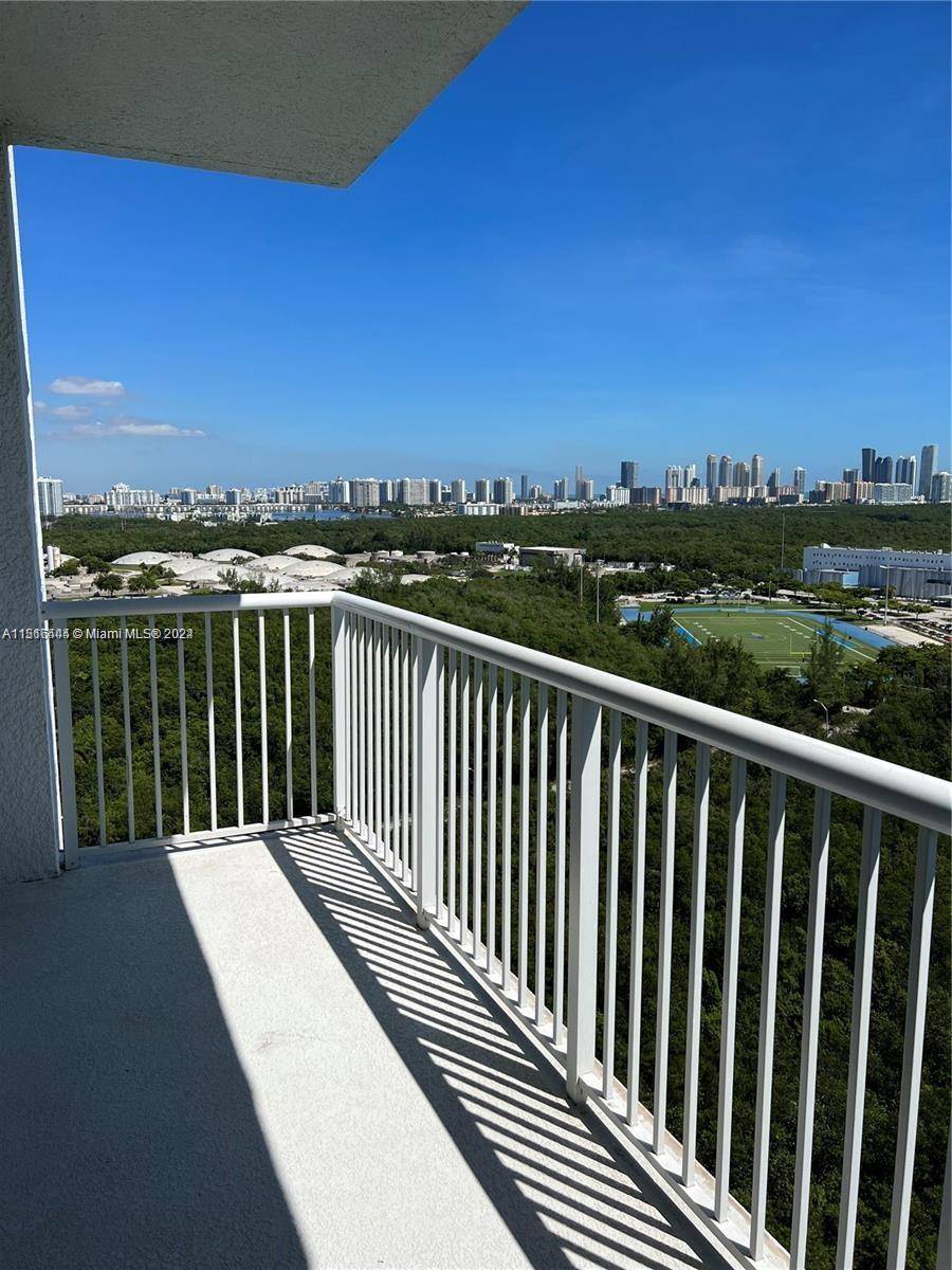 Gorgeous 3 3. 5 corner unit Balcony facing north east, with views of the surrounding forest, sunny isles beach, and the ocean on the horizon.