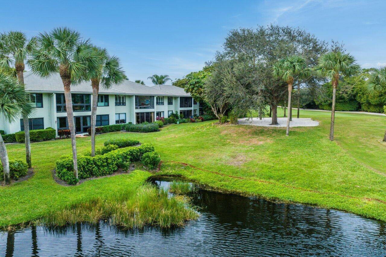 Beautiful golf course pond views in this lovely 2nd floor, 2 bedroom 2 bath corner residence.