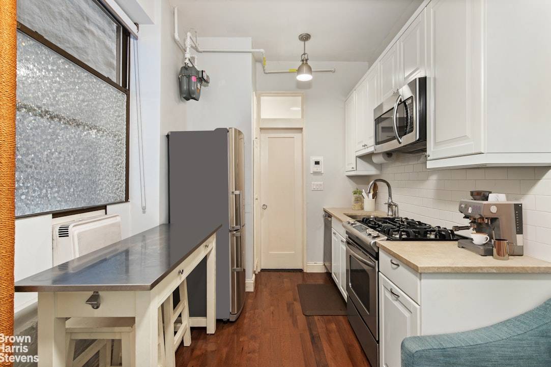 Apartment 1A is a beautifully renovated 2 bedroom, 1 bath home tucked within an intimate prewar Beaux Arts co op on a quiet, tree lined block.