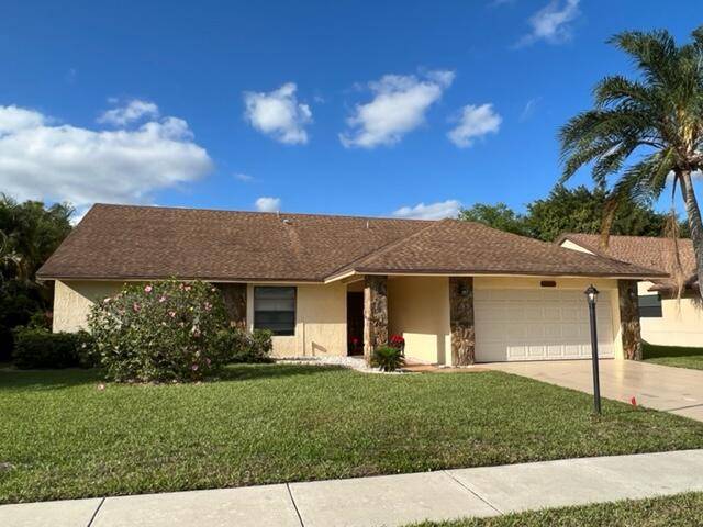 4 Bedroom 2 Bath Monaco model in Boca Fontana with Screened Roofed Patio and Spacious Fenced Yard.
