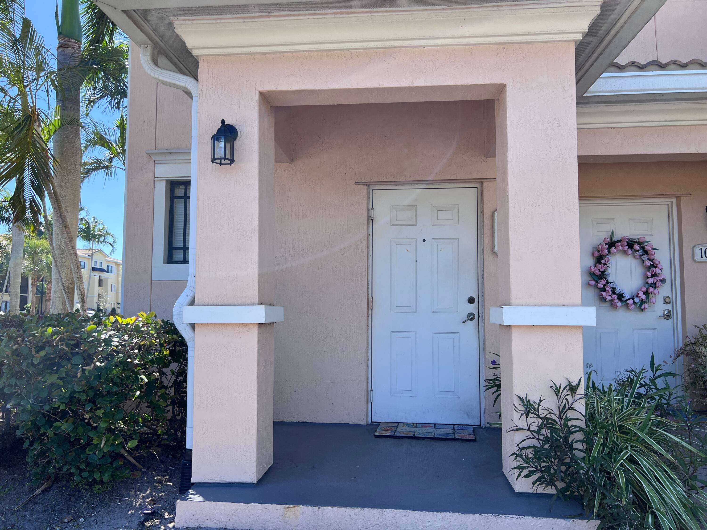 This is a corner unit with private entrance on first floor and interior stairs leading to the second floor living space.