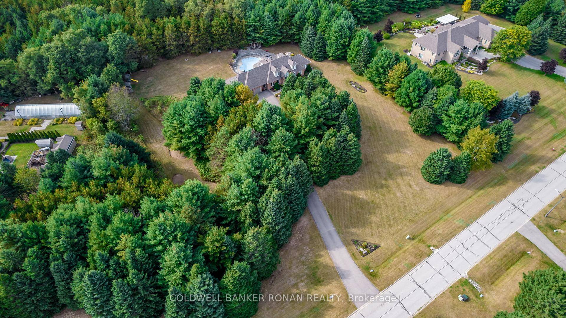 Welcome to this exceptional 2 storey custom built estate home, perfectly nestled on a private and mature treed 4.